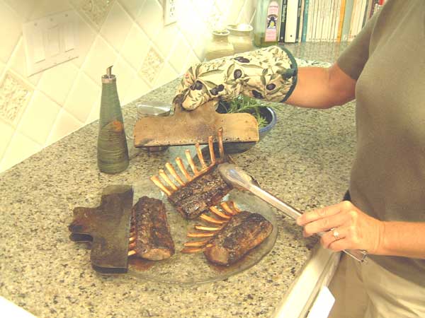 Remove bonetector from rack of lamb using a pot holder or rag -- Caution: Very Hot!